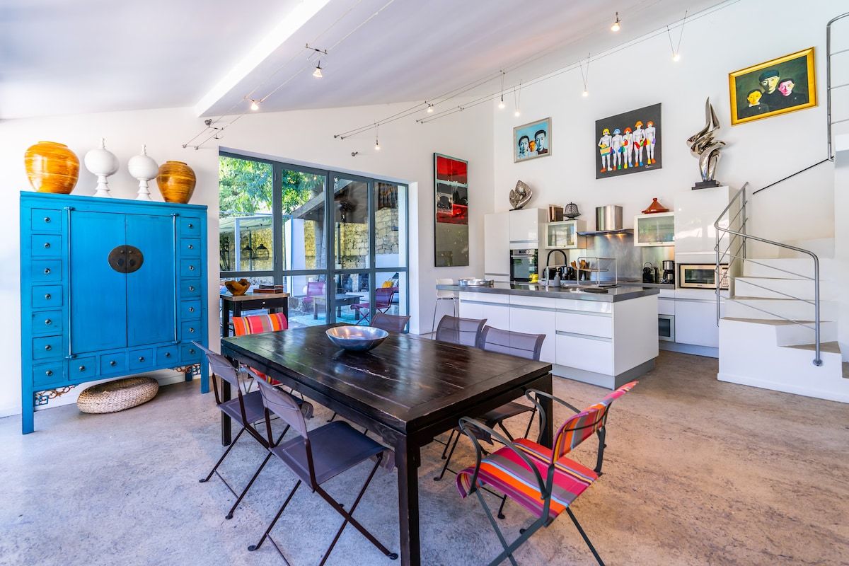 The kitchen, open to the garden through full-height glazing